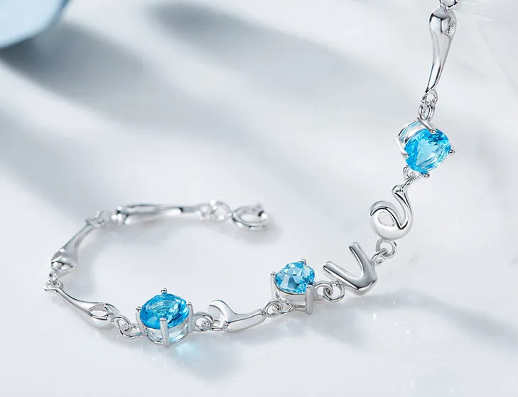 Sterling silver blue topaz LOVE bracelet