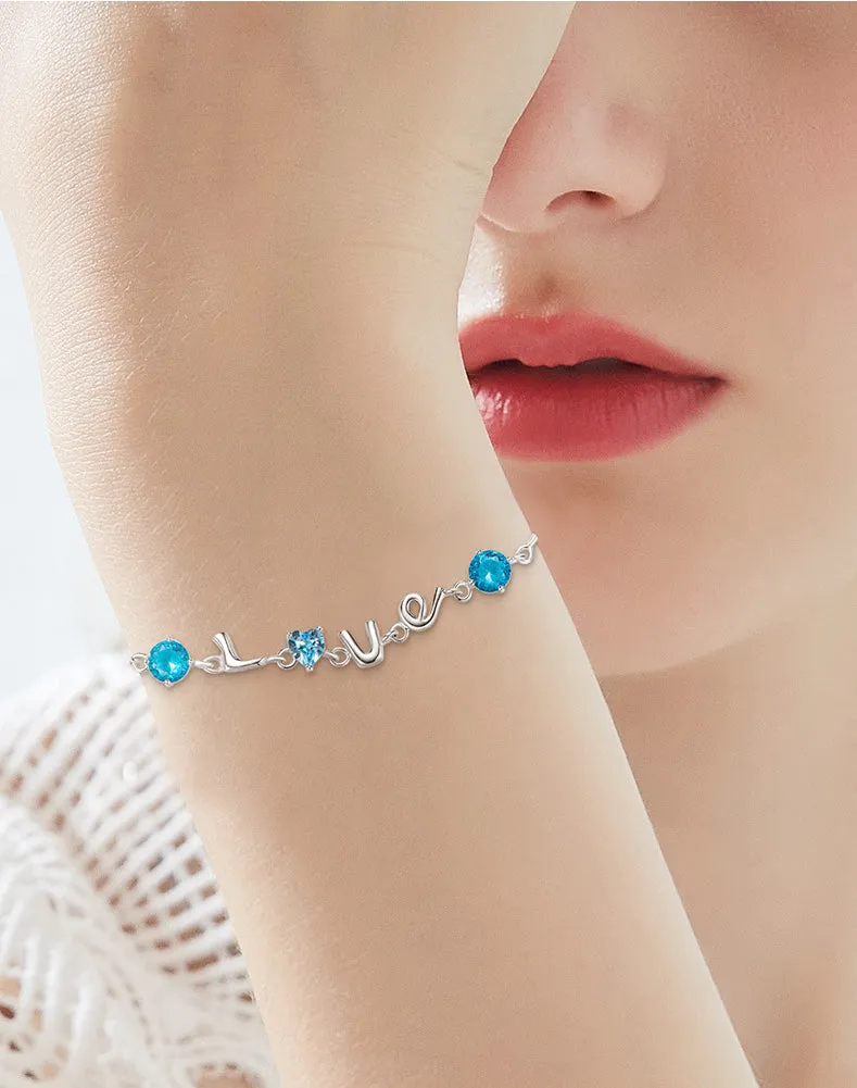 Sterling silver blue topaz LOVE bracelet