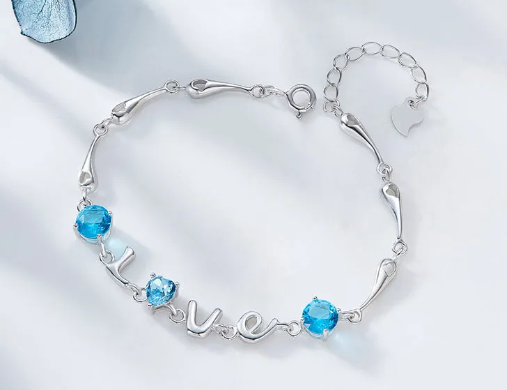 Sterling silver blue topaz LOVE bracelet