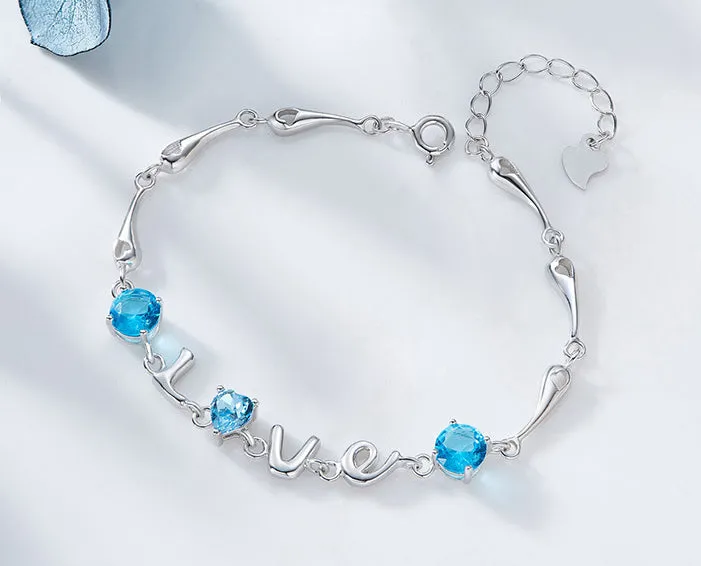 Sterling silver blue topaz LOVE bracelet